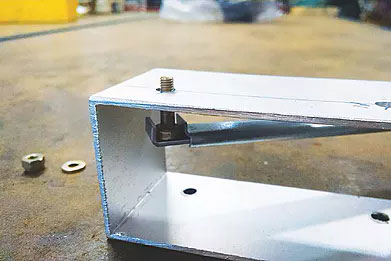 Handee Clamp holds bolts in those hard to reach places